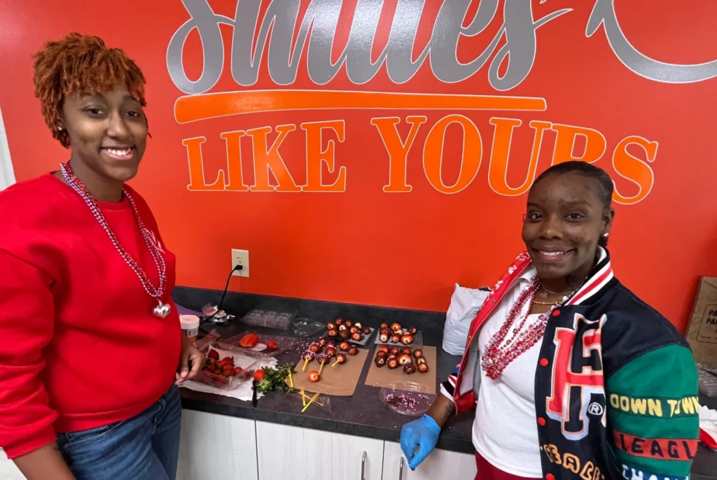 Smiles Like Yours team members preparing a fruit activity as part of meaningful activities for adults with developmental disabilities.
